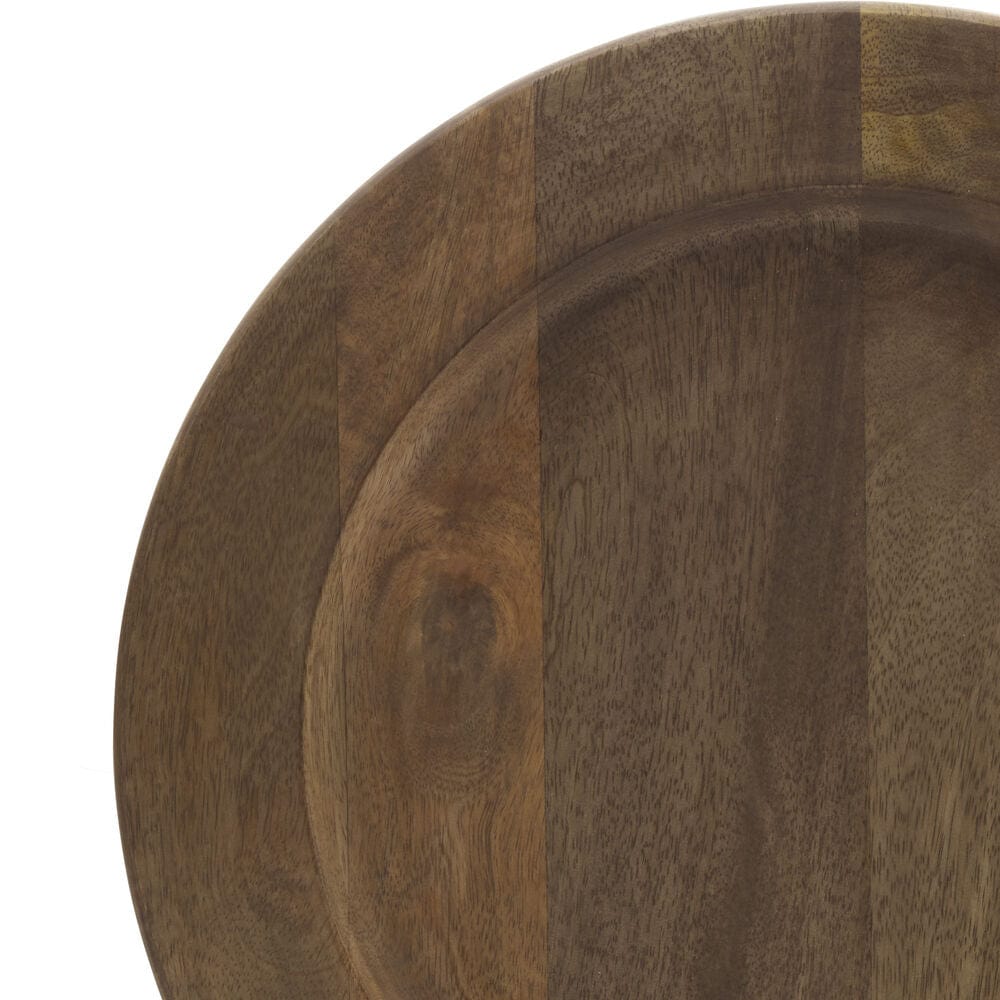 Close up of a mango wood charger showing patchwork grain with warm brown tones