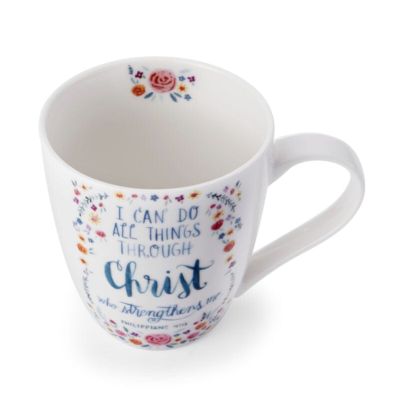 White ceramic mug with colorful floral border and the scripture I can do all things through Christ