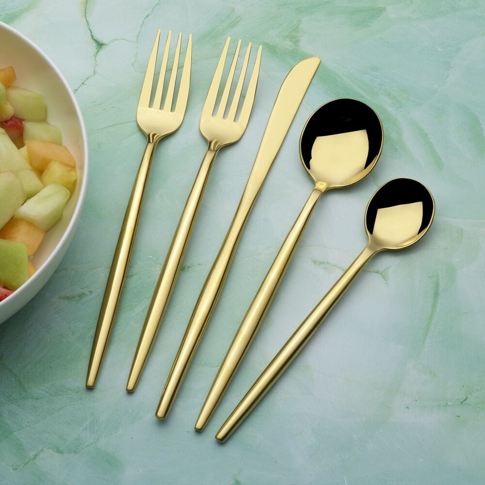 Shea Gold forged 20 piece flatware set for four in gold finish displayed on a light background