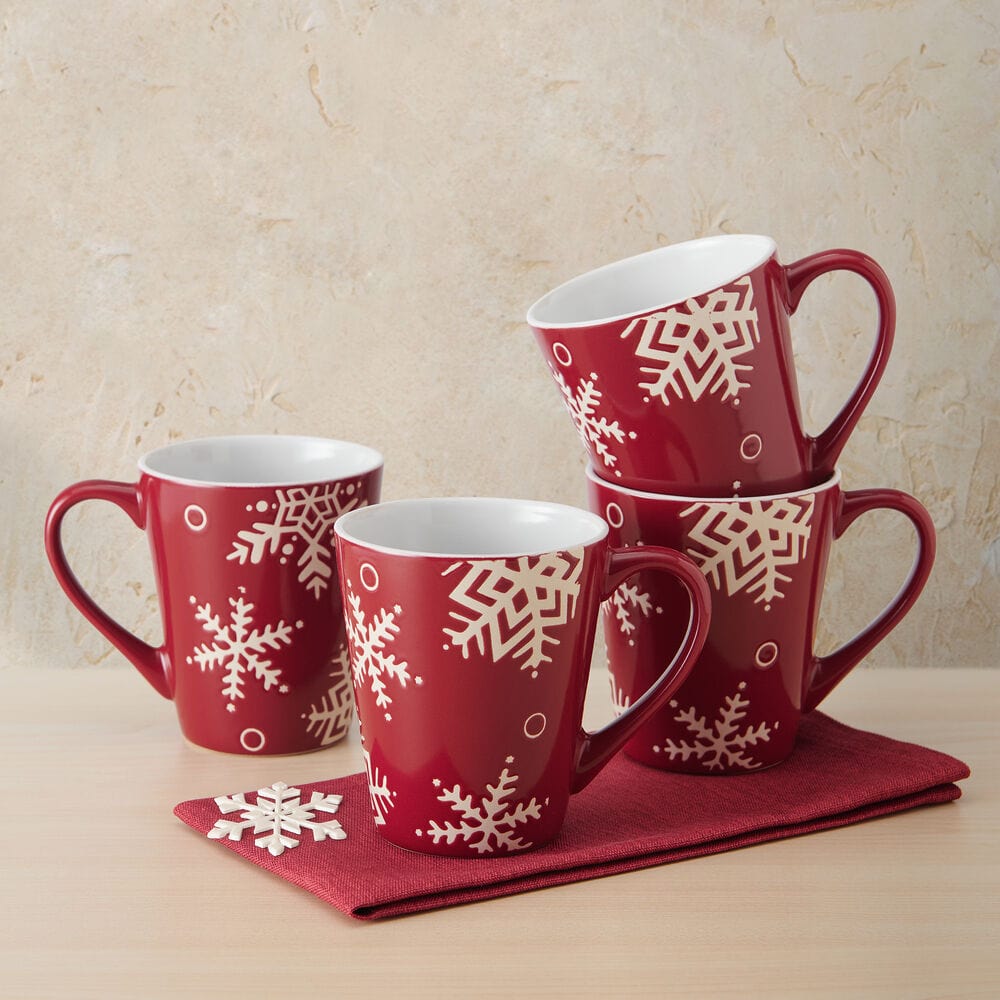 Snow Flurry Red set of four mugs with white snowflake designs on glossy red ceramic.