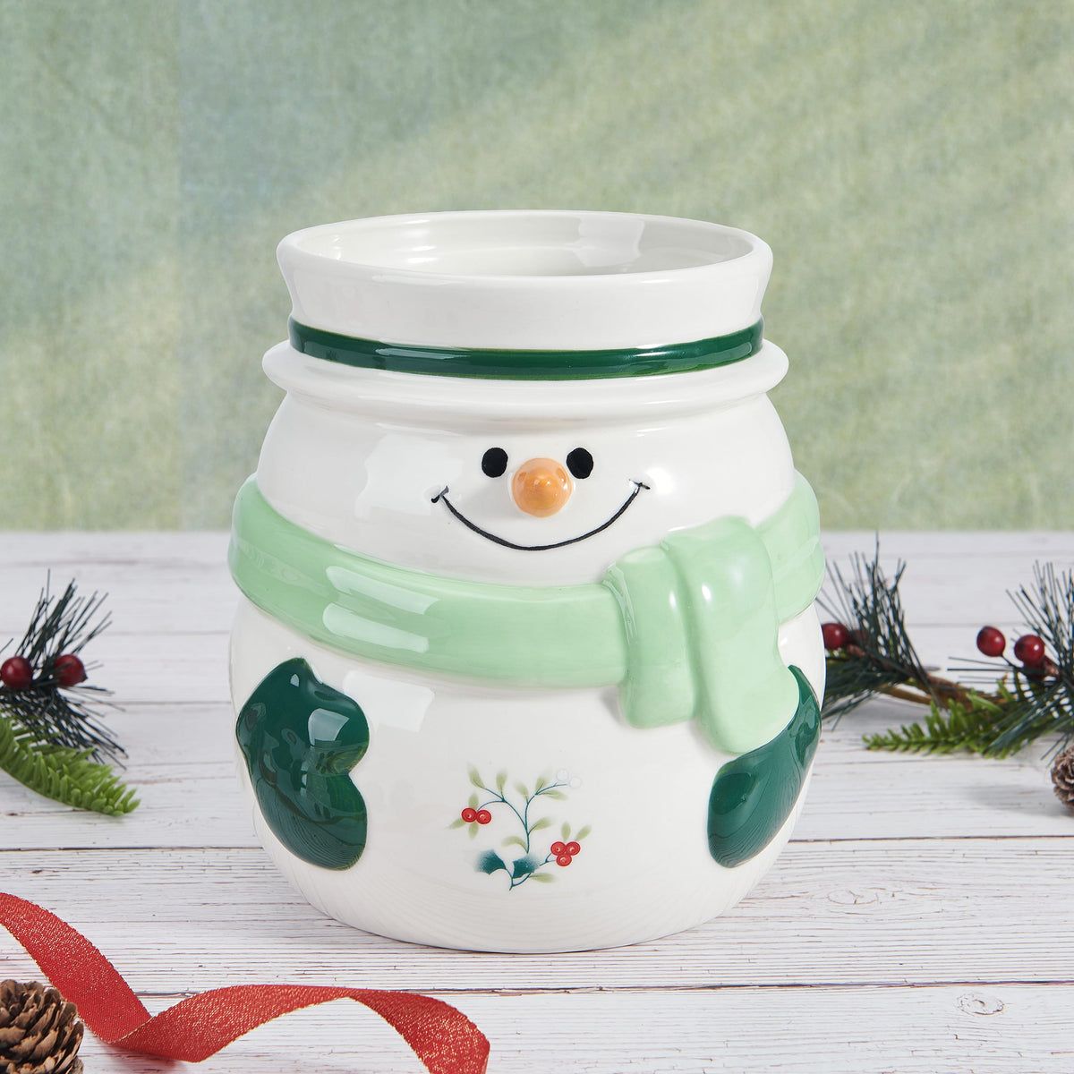 Winterberry Snowman Utensil Gadget Crock full front view in a festive setting with holly and greenery