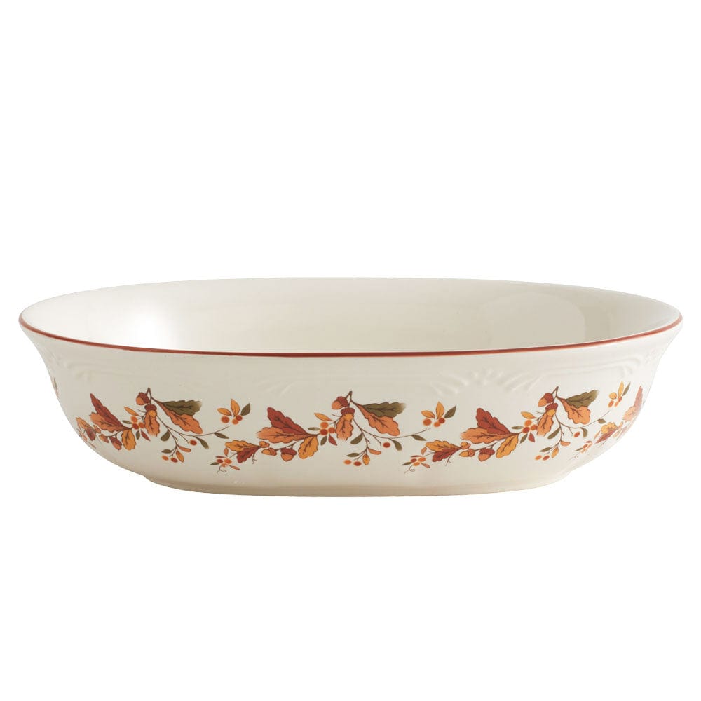 Cream serving bowl with autumn berry vine pattern around the exterior edge.