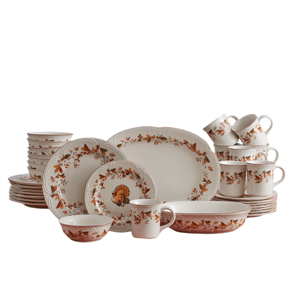 Autumn Berry dinnerware and serveware set for eight shown with plates bowls mugs and serving pieces on a table
