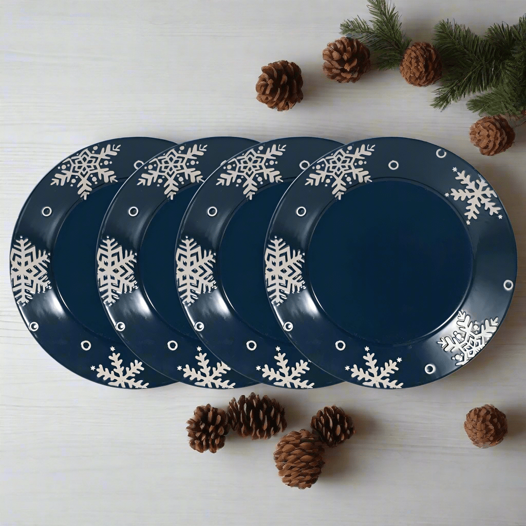 Set of four navy dinner plates with white snowflake border