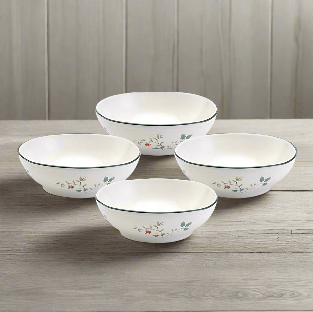 Winterberry four piece set of white bowls with green rims and holly pattern