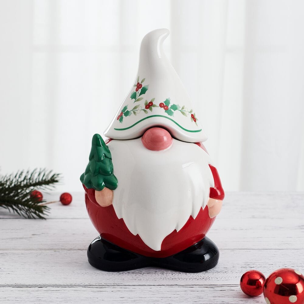 Winterberry Gnome Cookie Jar with a white beard, red outfit, and a small evergreen tree in one hand.