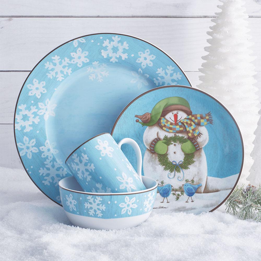 Evergreen Ernie blue winter dinnerware for eight featuring snowflake trim and snowman motifs on plates bowls and mugs