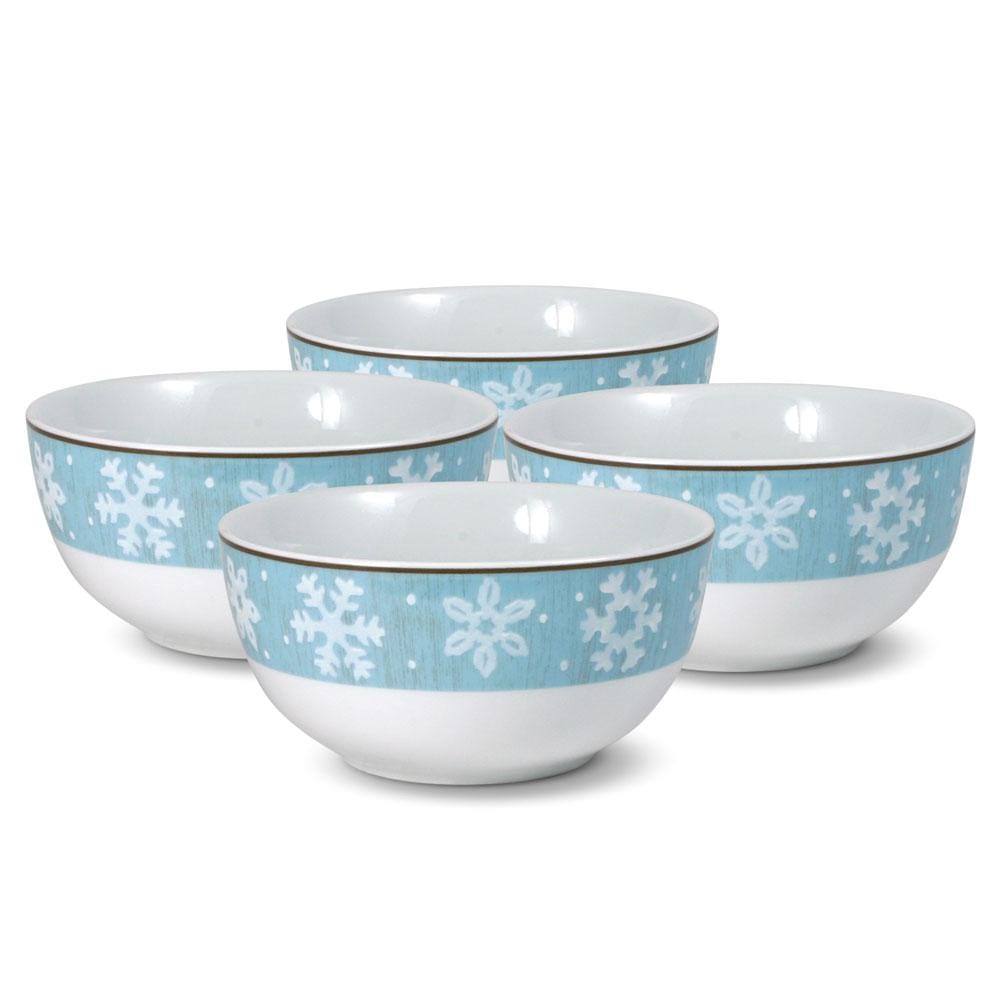 Group of four blue snowflake bowls shown from a different angle