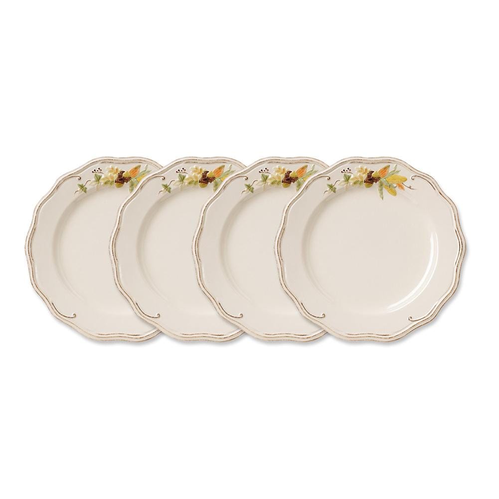 Plymouth dinner plates arranged in a row to highlight the floral border along scalloped edges.