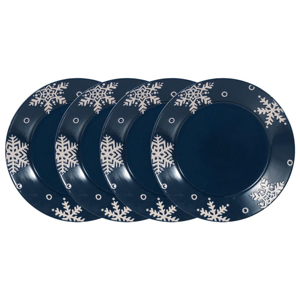 Four navy dinner plates with white snowflake motifs around the rims