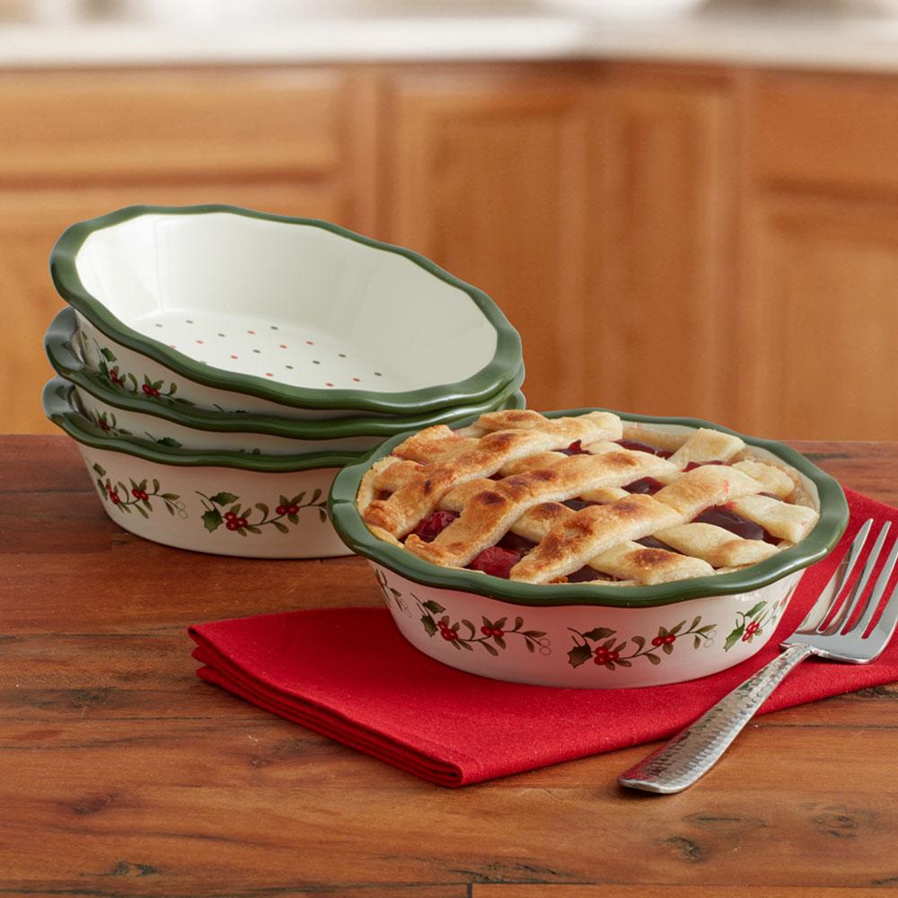 Winterberry four piece set of mini pie plates with green scalloped rims and holly motif