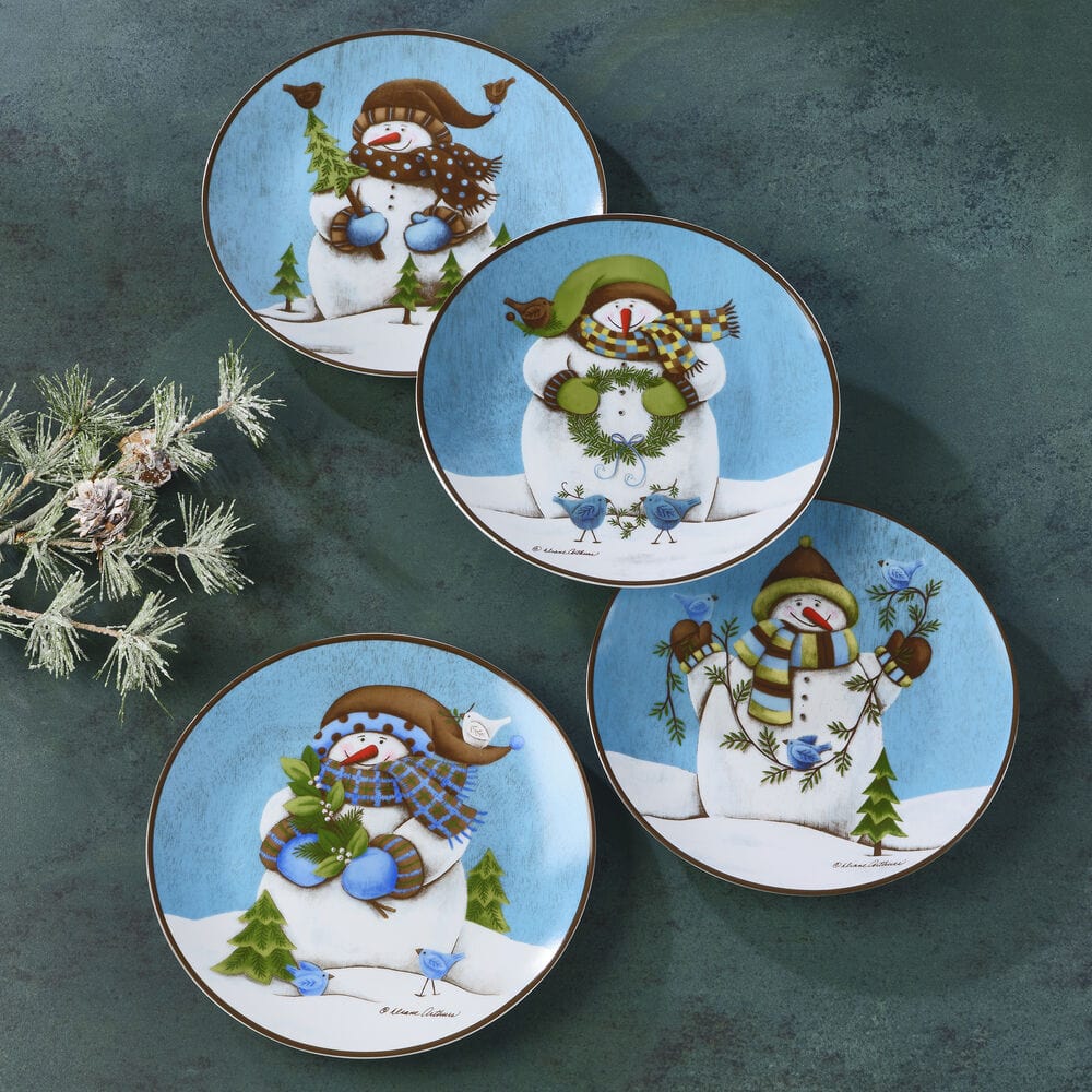 Evergreen Ernie set of four round salad plates arranged overlapping on a dark teal background