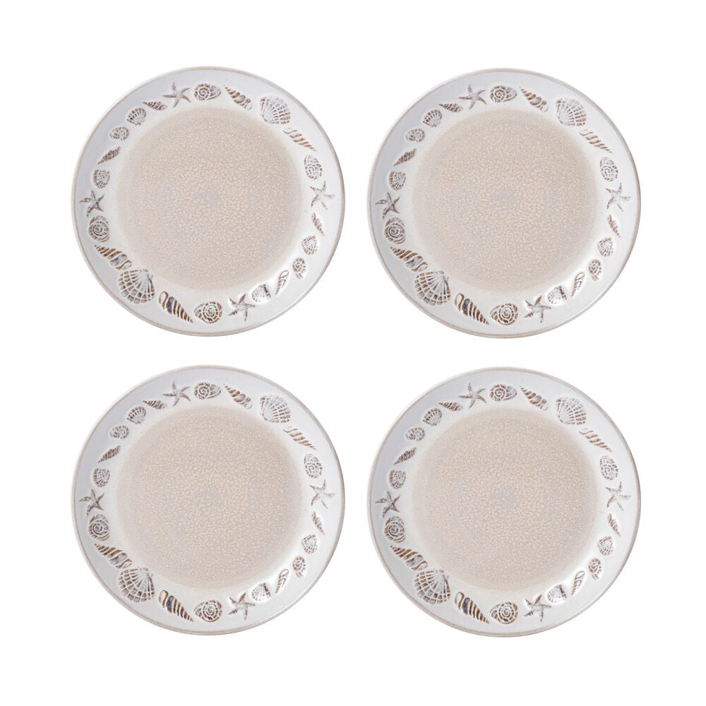 Four Panama dinner plates arranged in a square, each with beige center and shell border