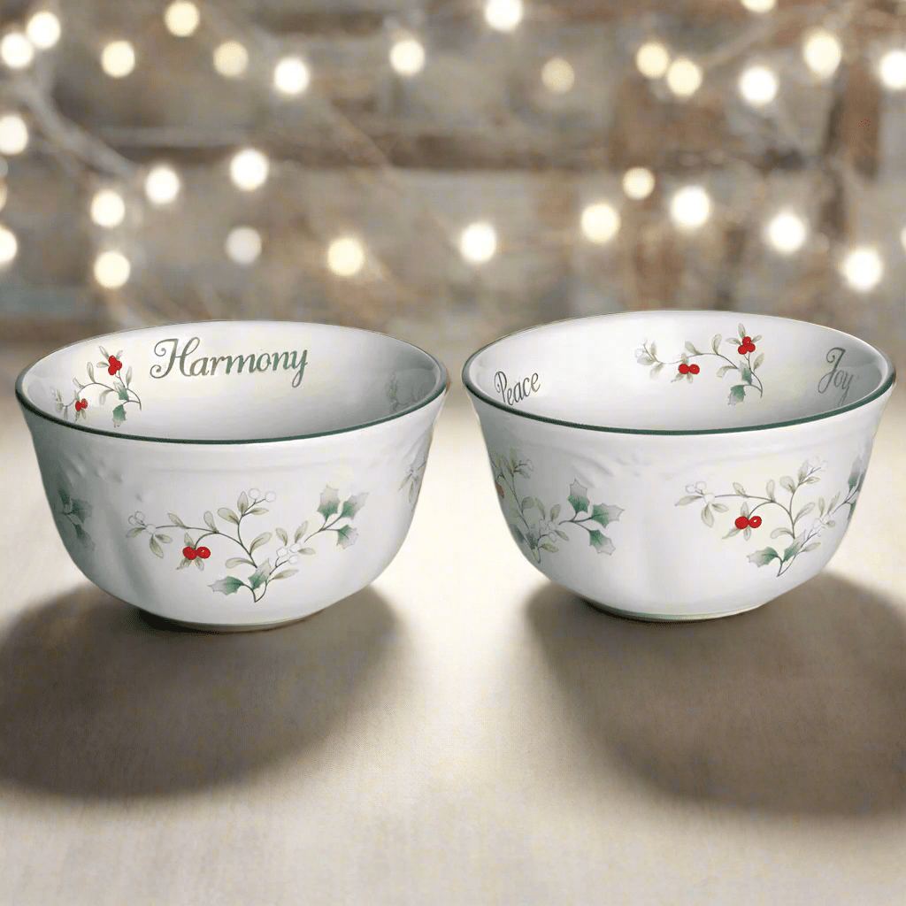 Set of two Winterberry dessert bowls in white porcelain with holly sprigs and Harmony Peace Joy inscriptions.