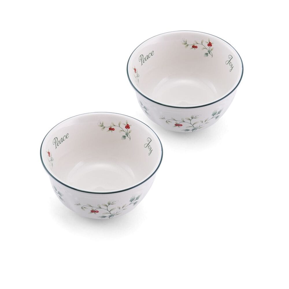 Two Winterberry dessert bowls viewed from above, interior shows Peace and Joy with holly patterns and teal rims.