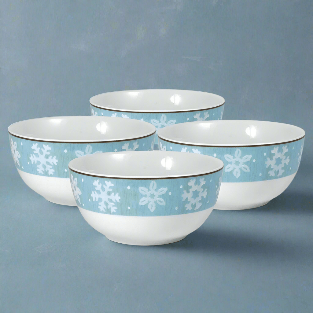 Set of four blue snowflake soup bowls with white interiors
