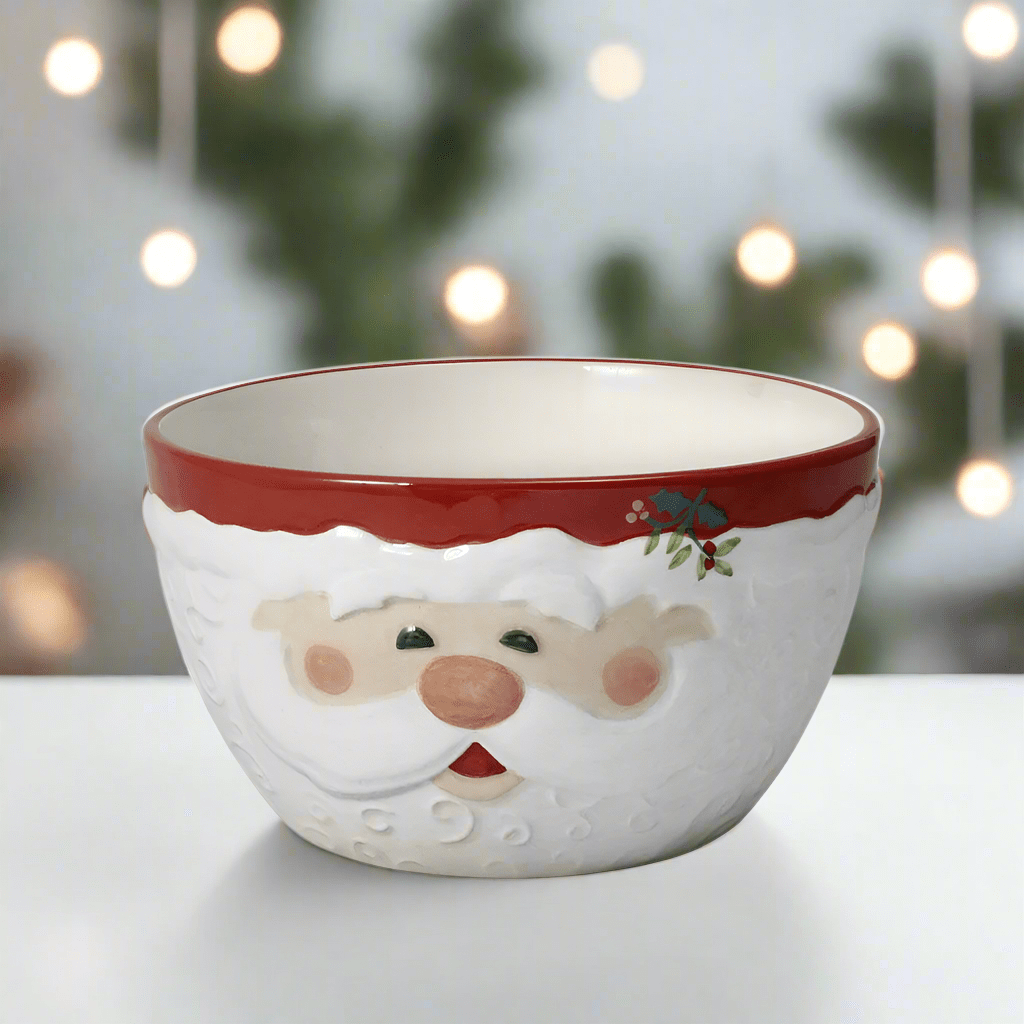 Winterberry Jolly Santa sculpted cereal bowl featuring Santa face on white ceramic with red rim and holly accent