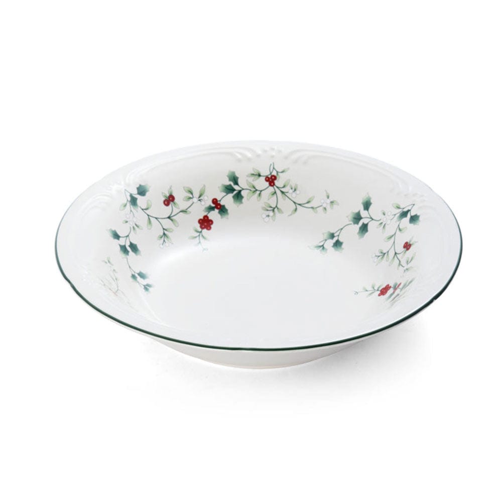 Close up of a Winterberry pasta bowl featuring holly and berry decor.