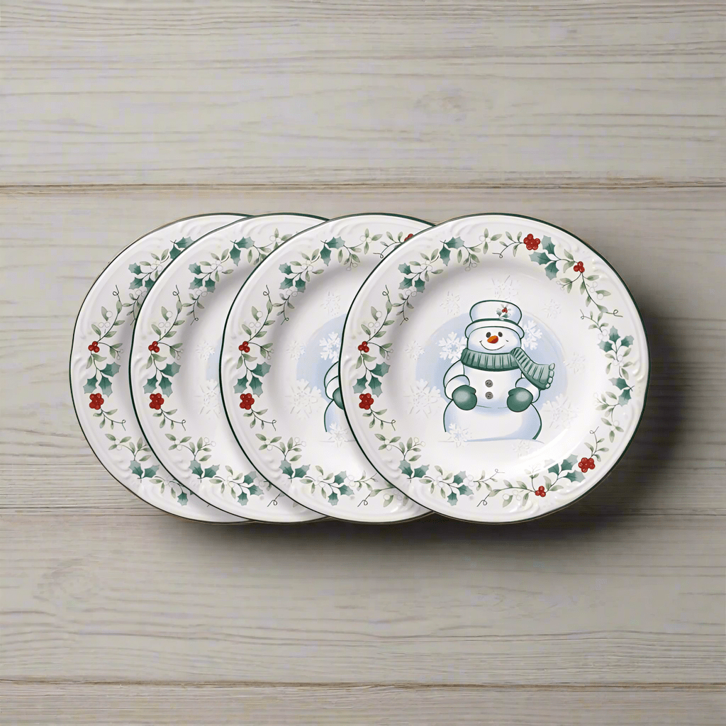 Winterberry set of four snowman salad plates with holly garland edging.