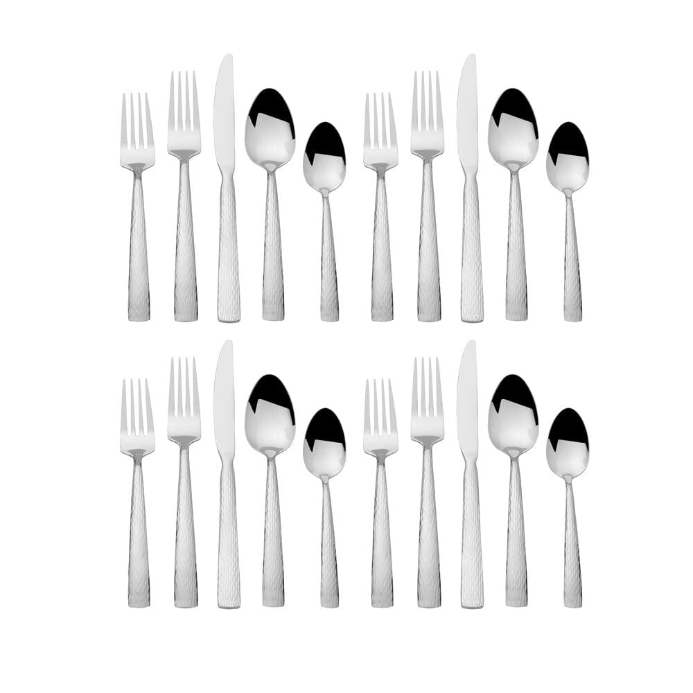 Two complete Elliott flatware sets for four laid out in two rows on a white background