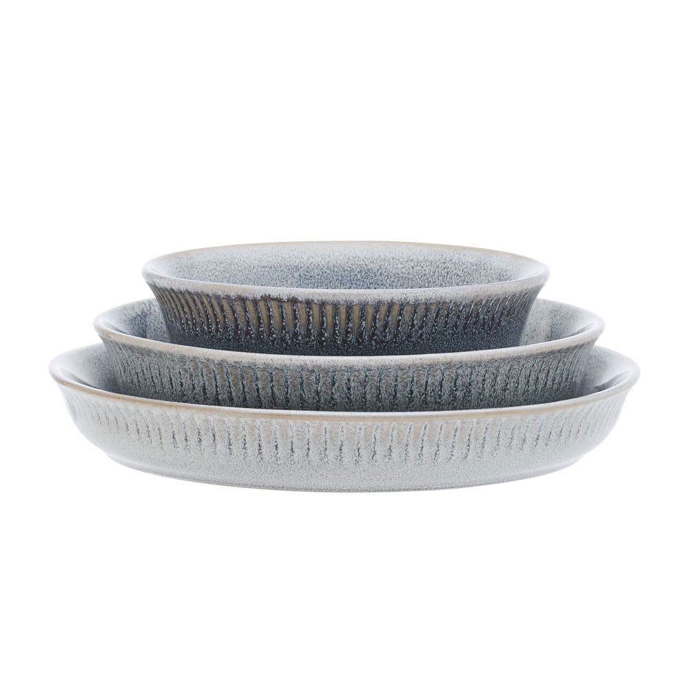 Three Amara Smoke bowls nested in varying sizes with blue gray speckled glaze