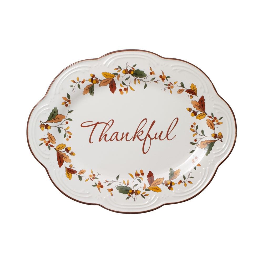 Top view of Autumn Berry small oval platter showing a decorative autumn leaf border and Thankful script