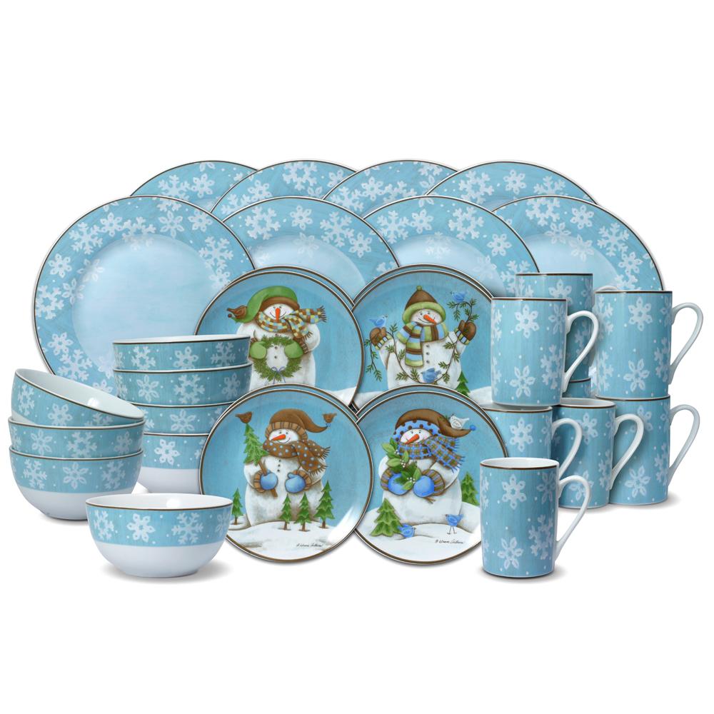 Expanded view of Evergreen Ernie winter dinnerware set showing multiple plates bowls and mugs in a coordinated blue snowflake design