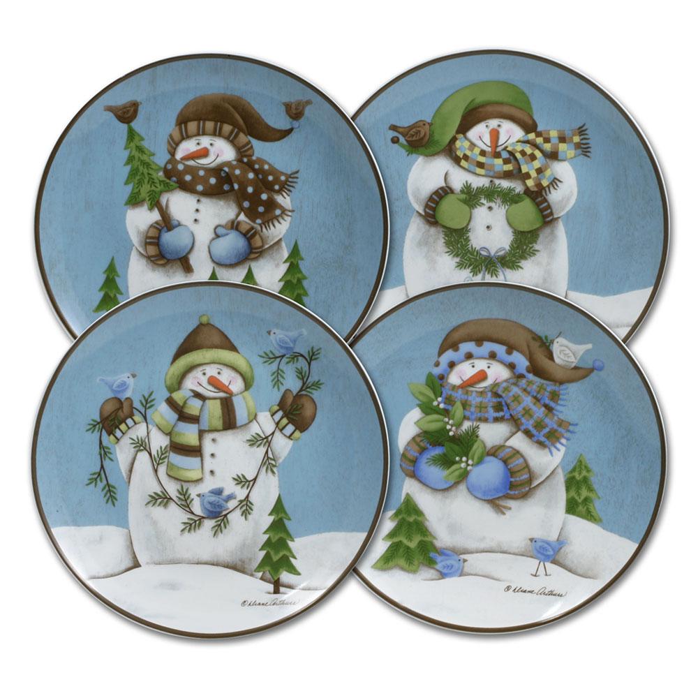 Evergreen Ernie four round salad plates laid out on a blue backdrop with snowmen and pine trees