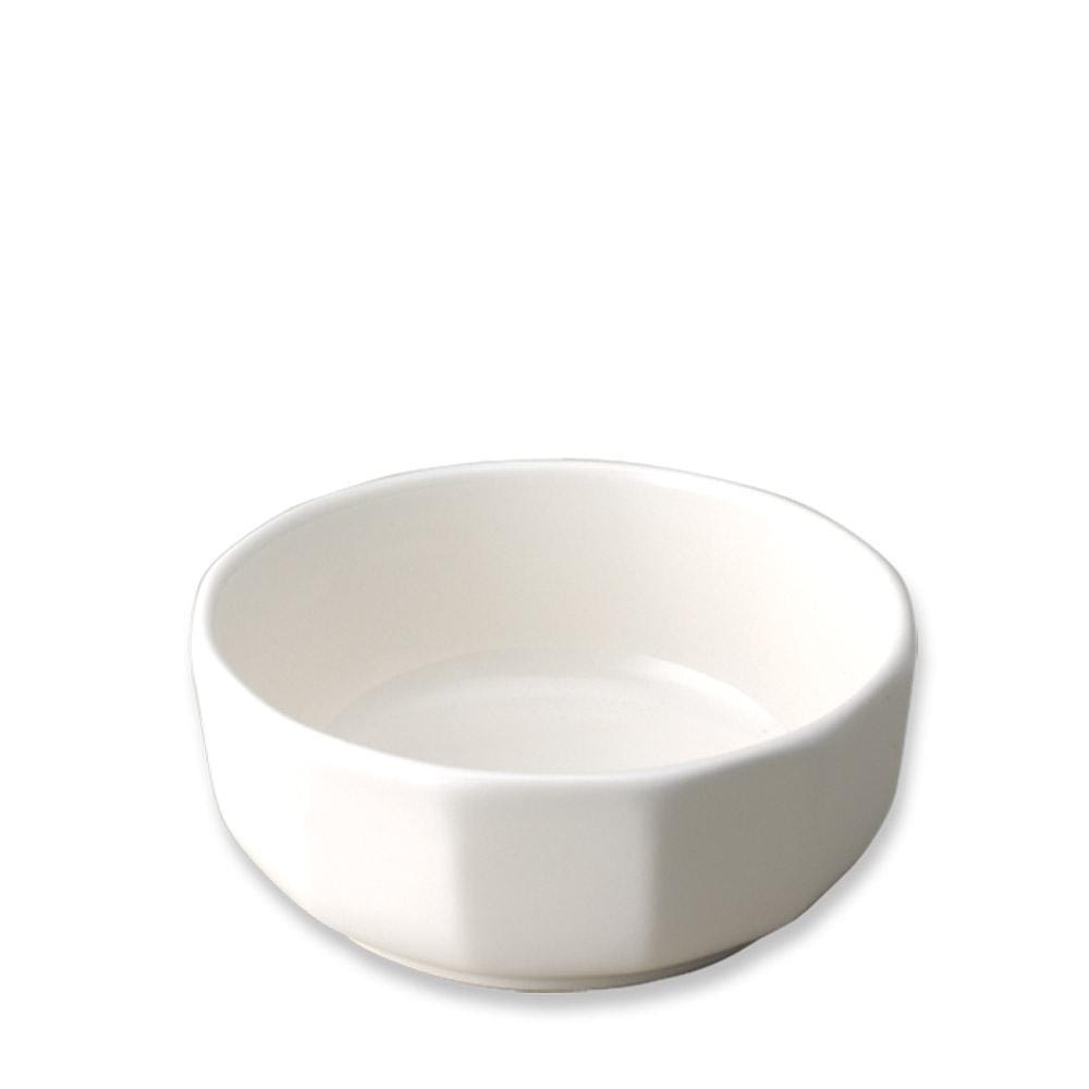 Heritage Soup Cereal Bowl placed on a matching plate with a spoon on a blue check tablecloth.