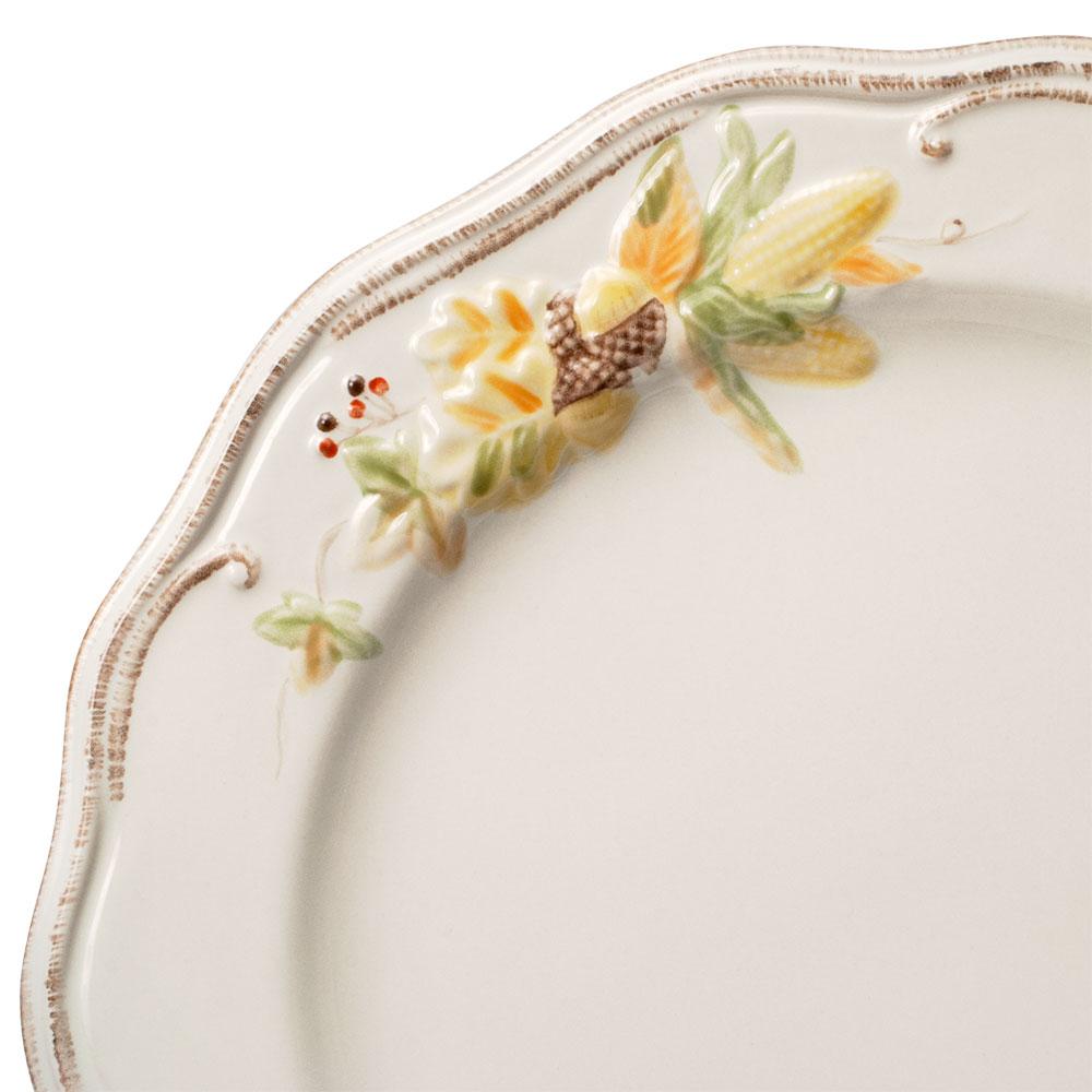 Close-up of Plymouth dinner plate edge with scalloped rim and hand painted floral detail