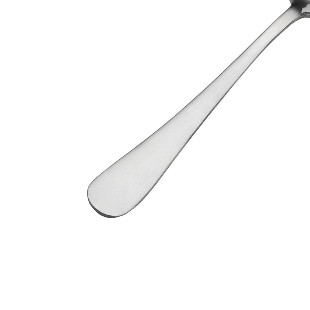 Close up of a satin finish dinner fork tip against a white background