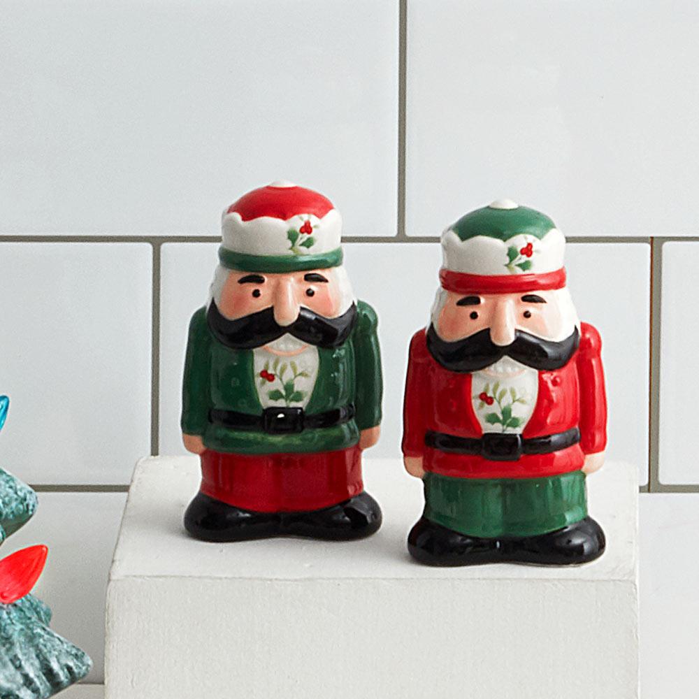 Winterberry nutcracker salt and pepper set featuring two ceramic figurines in red and green outfits
