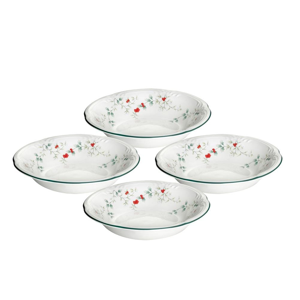 Winterberry set of four white pasta bowls with holly and red berry motif.