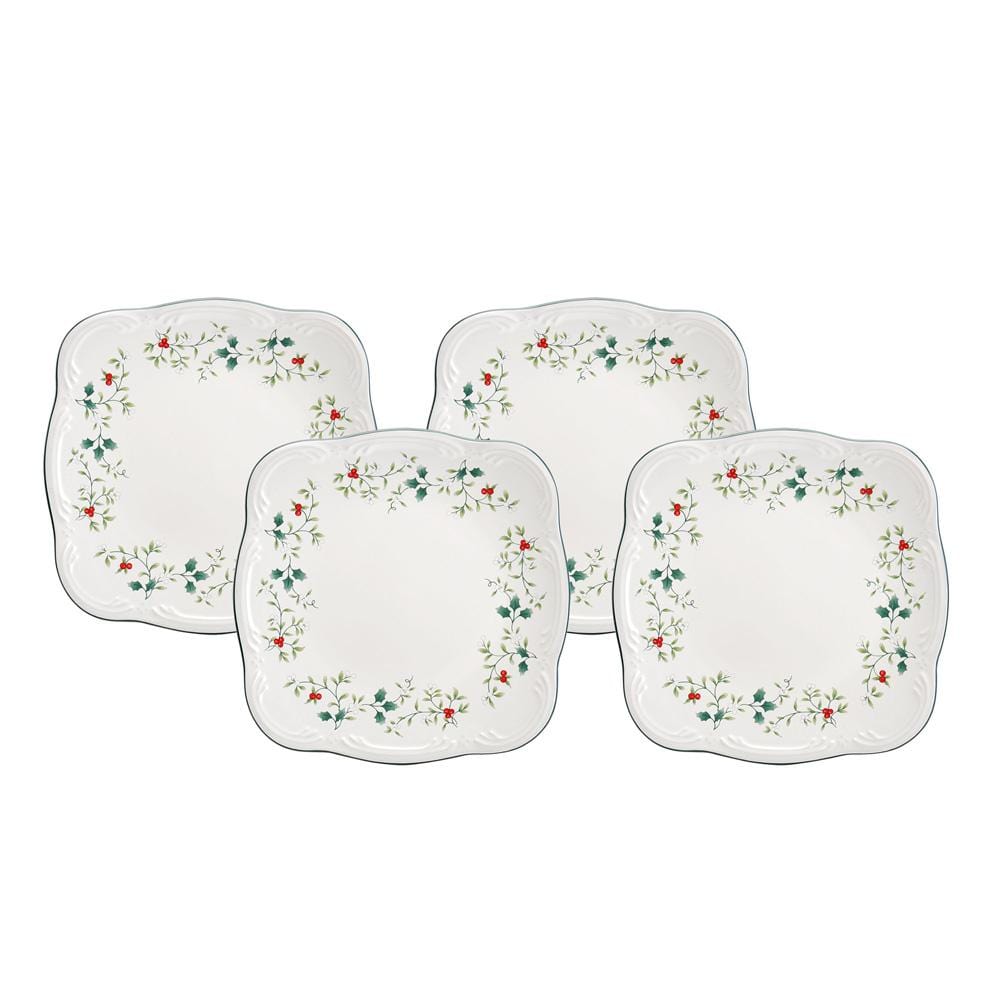Winterberry four square dinner plates with holly border arranged on a white background.